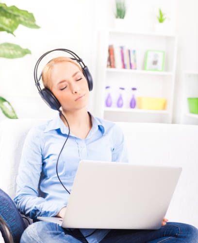 "Beautiful girl with headphones,listening music"